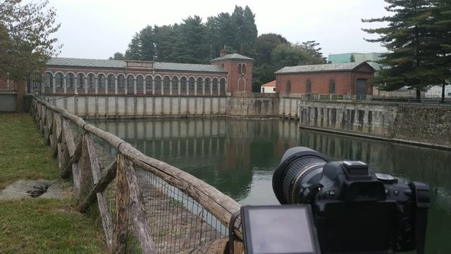 Chivasso, Piedmont, Italy. October 2019. The Cavour canal is a great work from the 1800s that captures the waters of the river Po. Making a film with a reflex camera on a tripod. Tilt movement.25fps