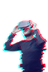 Man is using virtual reality headset on white isolated background. Glitch effect image.