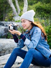 Happy Asian woman vintage camera with nature background, camping concept.