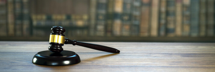 Law and Justice concept. Mallet of the judge, books, scales of justice. Courtroom theme.