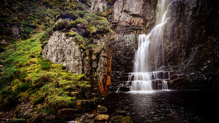 waterfall in forest scotland