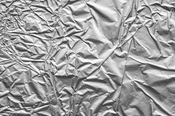 Shiny metal silver gray foil crumpled texture background