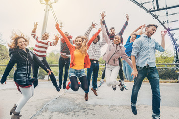 Diversity friends jumping in the park