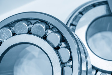 The cylindrical rolling bearing in the light blue scene. The close up scene of the mechanicals spare parts.