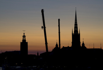Naklejka premium Sunset in Stockholm, with views of historical buildings in silhouette