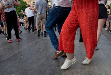 Local people enjoy an open-air swing dance session in a park in Stockholm,Sweden.
