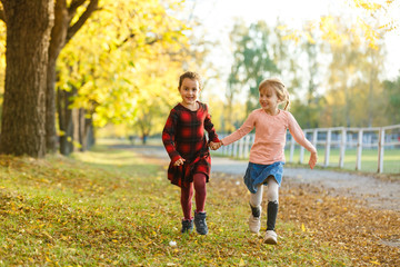 two girls in autumn park