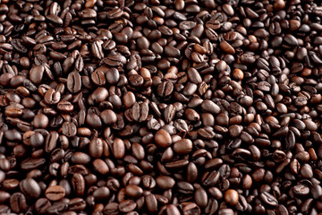 Roasted coffee beans background, arabica and robusta.