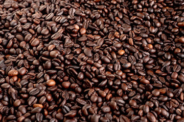 Roasted coffee beans background, arabica and robusta.