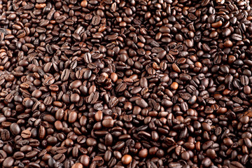 Roasted coffee beans background, arabica and robusta.