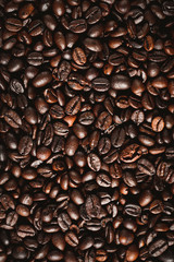 Roasted coffee beans background, arabica and robusta.