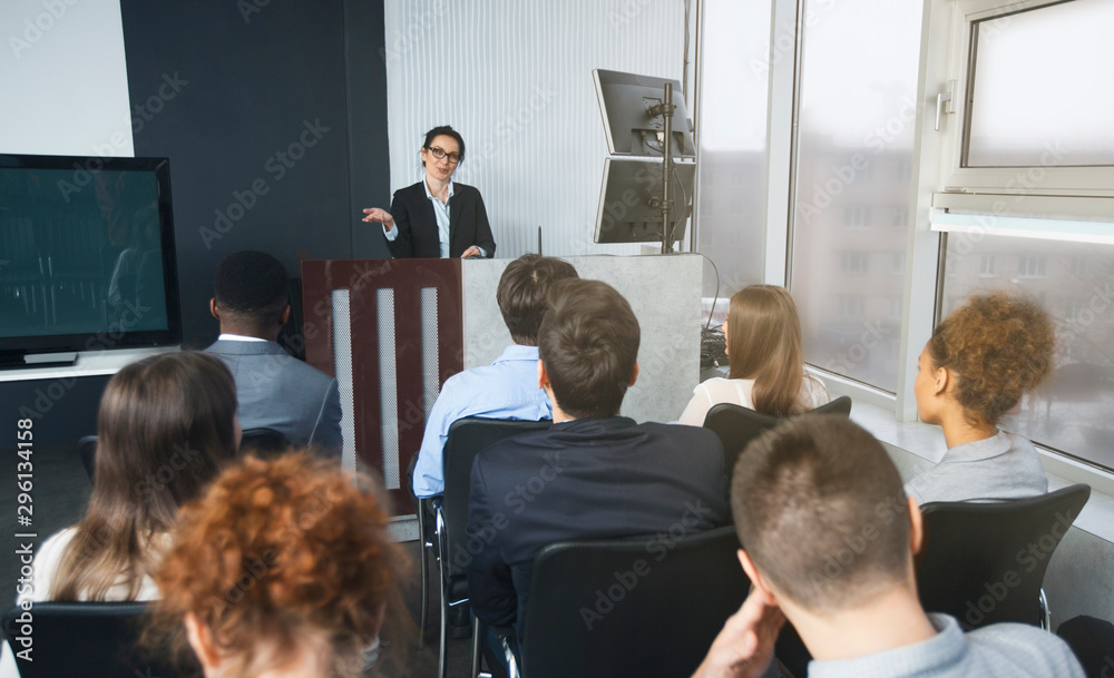 Poster Top manager reading lecture to colleagues at presentation