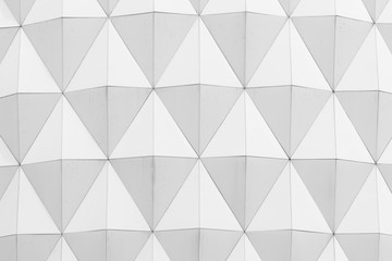 closeup view of white abstract diamond shape pattern architectural wallpaper, background or texture.