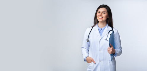 Confident Doctor Woman Smiling At Camera Standing, Studio Shot, Panorama