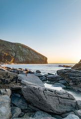 sunset on coast of sea