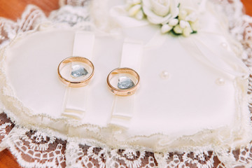 Wedding rings close-up. Wedding accessories bride and groom