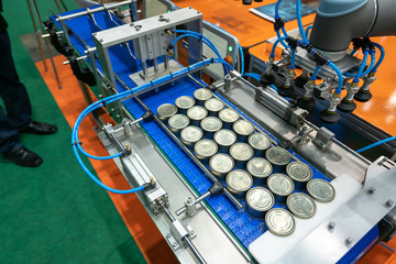 conveyor for the production of cans in factory. closed tin cans - Canned foods industry.