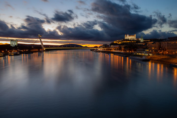 Obraz premium Bratislava's famous restaurant on top of the bridge captured in full sunset