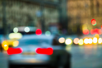 Abstract blurred background of evening city.Night traffic,colorful lights