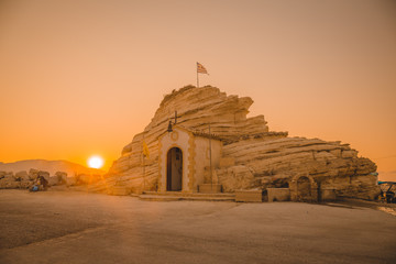 Rock with chapel in Agia Sostis. Bay of Laganas, Zakynthos island, Greece. At sunrise during summer full holiday seson.