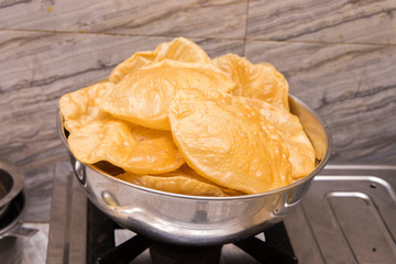 puri or poori indian delicious fast food made of flour fried with vegetable oil