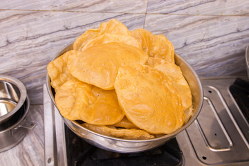 puri or poori indian delicious fast food made of flour fried with vegetable oil