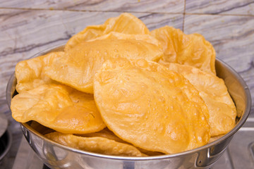 puri or poori indian delicious fast food made of flour fried with vegetable oil