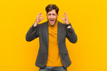  screaming in panic or anger, shocked, terrified or furious, with hands next to head