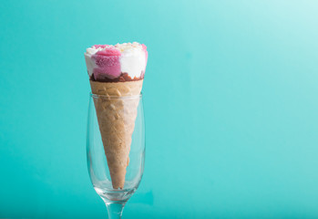 background of three flavored ice cream scoops on cones