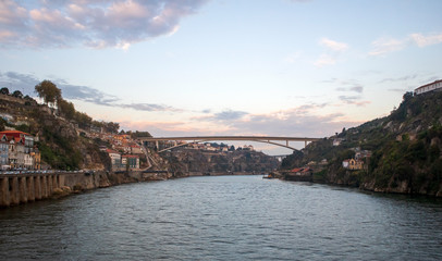 Fototapeta na wymiar View of Porto downtown on Douro river banks with famous Dom Luis I Bridge, Portugal