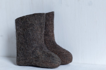 boots on a light background, shot indoors in the light from the window