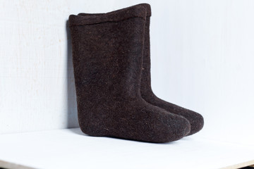 boots on a light background, shot indoors in the light from the window