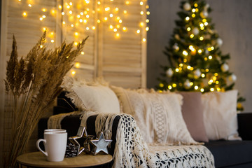 Christmas background - cozy interior with decorated Christmas tree and garlands
