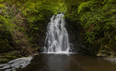 Fototapeta na wymiar Glenoe waterfall, Larne, County Antrim, Northern Ireland, Waterfalls in County Antrim, Ulster, Northern Ireland 