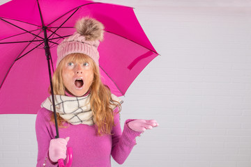 Fototapeta premium open umbrella woman and winter clothes