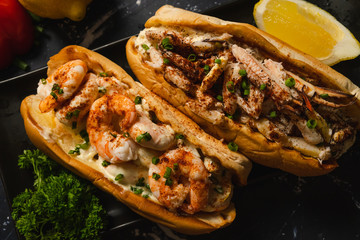 Top view of Crab roll and Shrimp roll on black plate