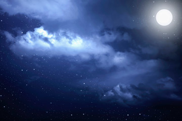 Starry night sky with stars and moon in cloudscape background