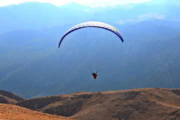 group of paragliders take off from high mountain Tahtali