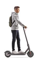 Male student with a backpack riding an electric scooter