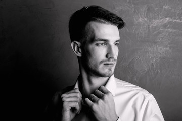 Fototapeta premium Portrait of a young guy black and white
