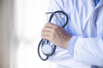 Healthcare and medical concept. Medicine doctor with stethoscope in hand Hospital background.