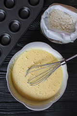 dough liquid, raw ingredients (eggs, flour, sugar, salt and more) menu concept. food background. copy space. Top view