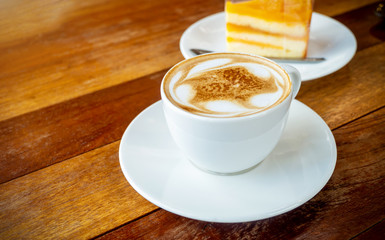 White coffee cup, Latte coffee on wooden table in coffee shop, with empty space for text. concept relax
