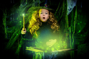 little witch casts a spell - obrazy, fototapety, plakaty