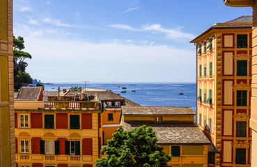 Fototapeta premium Colorful buildings and beach at Camogli on sunny summer day, Liguria