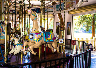 Children's Carousel in a public park - 296156367