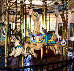 Children's Carousel in a public park - 296156535