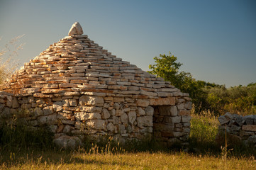 Traditional istrian hut - Kazun,  with blue sky in background.