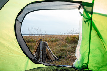 Camping view from the tent on the nature. The concept of travel, tourism, camping.