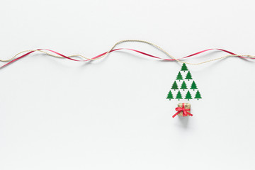 Christmas composition. Tree gift ribbon top view background with copy space for your text. Flat lay.